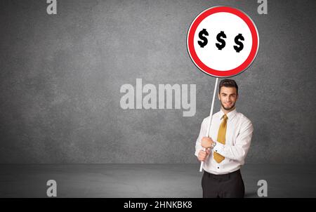 Young business person holdig traffic sign Stock Photo