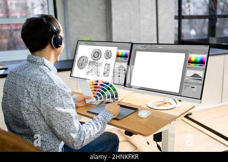 African Graphic Web Designer Using Design Editing Software Stock Photo