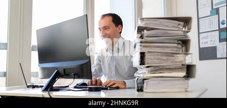 Accountant With Folders Paper Stack Doing Invoice Audit Stock Photo