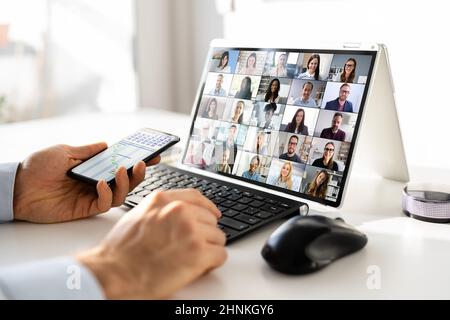 Virtual Business Presentation Or Videoconferencing On Hybrid Screen Stock Photo