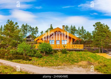 Norwegian wooden cabins cottages in the nature landscape Nissedal Norway. Stock Photo