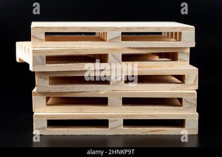 Sturdy wooden pine pallet used in transportation and storage, euro pallet, epal pallet, isolated on black background Stock Photo