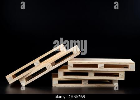 Sturdy wooden pine pallet used in transportation and storage, euro pallet, epal pallet, isolated on black background Stock Photo