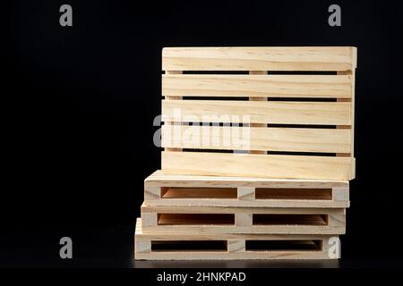 Sturdy wooden pine pallet used in transportation and storage, euro pallet, epal pallet, isolated on black background Stock Photo