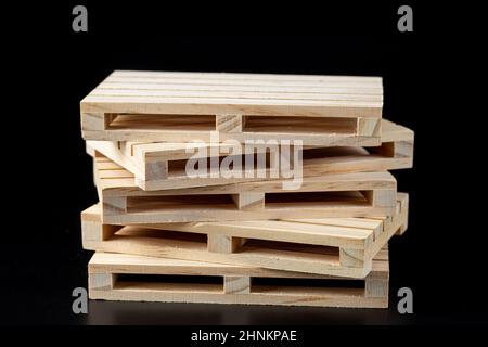 Sturdy wooden pine pallet used in transportation and storage, euro pallet, epal pallet, isolated on black background Stock Photo