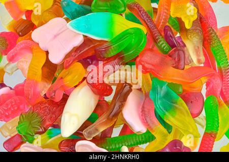 Assorted tasty gummy candies. Top view. Fruit gummy candies background Stock Photo