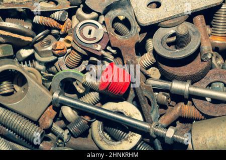 Pile of fasteners and screws close up. scrap metal. different metal details Stock Photo