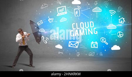 Businessman defending with umbrella, modern technology concept Stock Photo