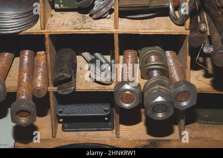 Metal bolts and nuts in the work shelf. various fasteners Stock Photo