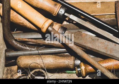 Pile of the old rasps. different carpentry files. various graters. instrument for wood processing Stock Photo