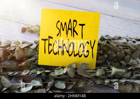 Text sign showing Smart Technology, Business overview used to protect and prevent errors in hard drives Blank Piece Of Sticky Note Placed On Top Of A Stock Photo
