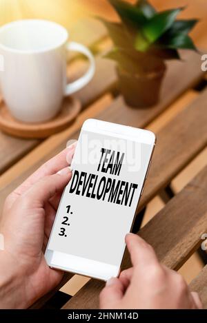 Text caption presenting Team Development, Concept meaning learn why and how small groups change over time with graphs Voice And Video Calling Capabili Stock Photo