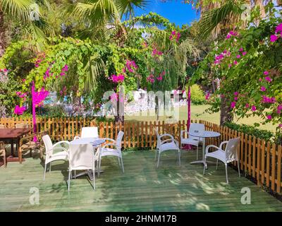 Table and chairs in empty cafe near the beach. Kemer, Turkey. Close up Stock Photo