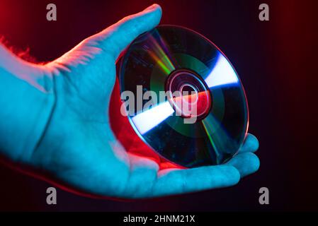 Cd hold in hand Stock Photo