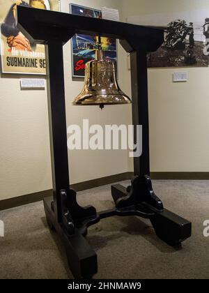 WWII ship's bell in a the museum at Pearl Harbor Stock Photo