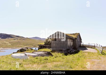 Idyllic hut with fishing boats near vavatn lake Hemsedal, Norway. Stock Photo