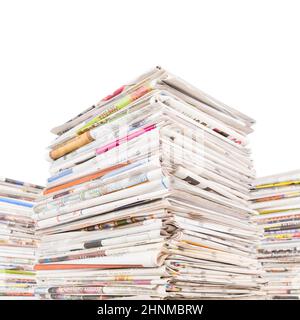 Three big stacks of newspapers Stock Photo
