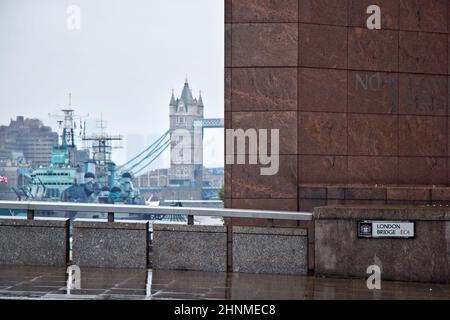 London, United Kingdom - October 7th, 2006: No 1 London Bridge building, with HMS Belfast and Tower Bridge over river Thames in background, shot on rainy overcast day. Stock Photo