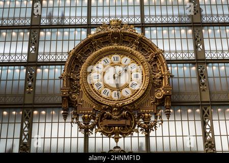 PARIS -SEPTEMBER 7, 2014: Golden clock of the museum D'Orsay in Paris, France. Musee d'Orsay has the largest collection of impressionist and post-impressionist paintings in the world. Stock Photo