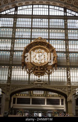 PARIS -SEPTEMBER 7, 2014: Golden clock of the museum D'Orsay in Paris, France. Musee d'Orsay has the largest collection of impressionist and post-impressionist paintings in the world. Stock Photo