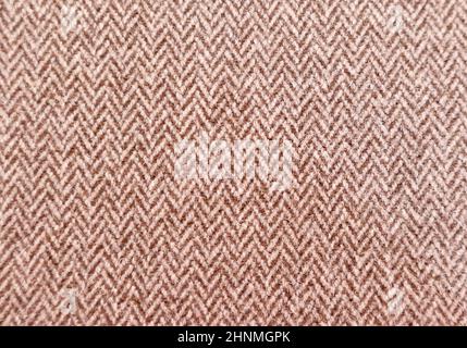Full frame brown and white textured herringbone furnishing or fashion fabric Stock Photo