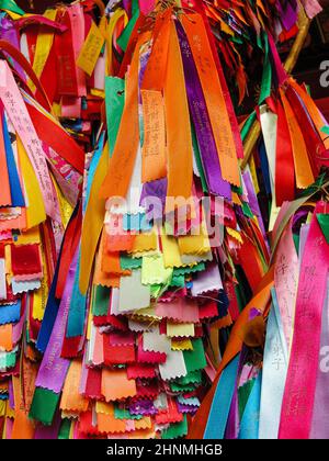 Many colorful ribbons with wishes hangs in the temple. Georgetown, Penang, Malaysia Stock Photo