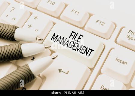 Hand writing sign File Management, Word for computer program that provides user interface to manage data Publishing Typewritten Fantasy Short Story, T Stock Photo