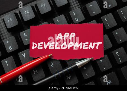 Conceptual caption App Development, Business concept Development services for awesome mobile and web experiences Transferring Written Notes To A Compu Stock Photo