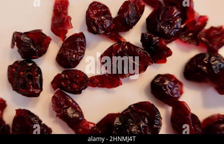 Close up of dried red cranberries on plain white background Stock Photo