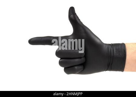 Male hand in a black disposable glove showing a finger gun gesture. Side view, isolated on white. Stock Photo