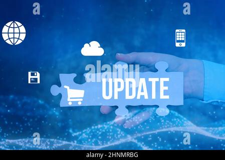 Sign displaying UPDATE, Conceptual photo make something more modern or up to date like software program Hand Holding Jigsaw Puzzle Piece Unlocking New Stock Photo