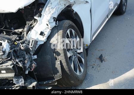 Car crash or accident. Front fender and light damage . Broken vehicle detail or close up. Stock Photo