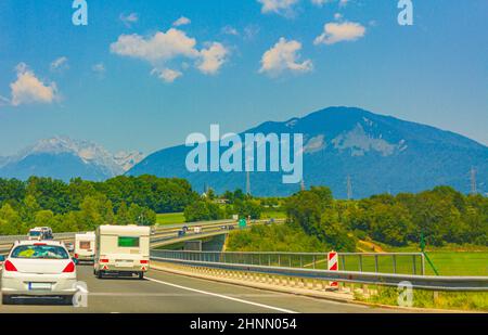 Driving on highway to Kranj Slovenia with mountain range panorama. Stock Photo