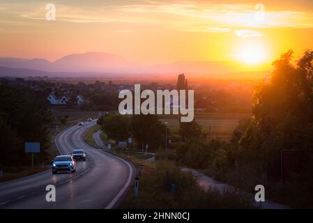 traffic on asphalt road or highway route at sunset time Stock Photo