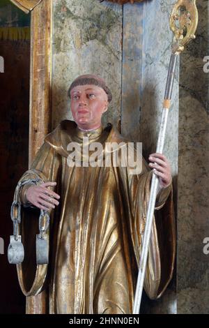 St. Leonard, a statue on the altar of Saint Valentine in the Church of the Visitation of the Virgin Mary in Vinagora, Croatia Stock Photo