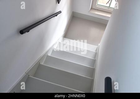 Stairs leading upstairs in a house, going down on staircase Stock Photo