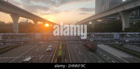 Light trails on motorway highway at night, long exposure abstract urban background Stock Photo