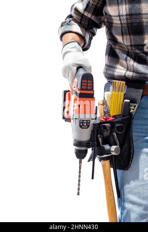 Carpenter worker at work holding rechargeable hammer drill, isolated on white background. Construction industry. Carpentry. Stock Photo