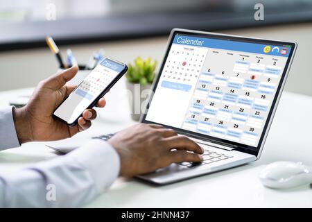 African American Doing Calendar Schedule Planning. Business Agenda In Office Stock Photo