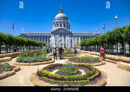 people visit the garden in front of City Hall in San Francisco, USA. San Francisco City Hall is the seat of government for the City and County of San Francisco Stock Photo