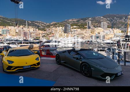 Monaco, Monte-Carlo, 27 September 2019: Two luxury sport cars Lamborghini of dark color are in port Hercules in shadow, very aggressive view of Stock Photo