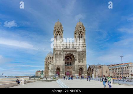 Tourists walking in front of the Cathedrale de la Major in Marseilles. Built between 1852 and 1893, it is considered as one of the biggest cathedrals of its time Stock Photo