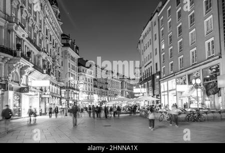 people visit Graben street in Vienna by night Stock Photo