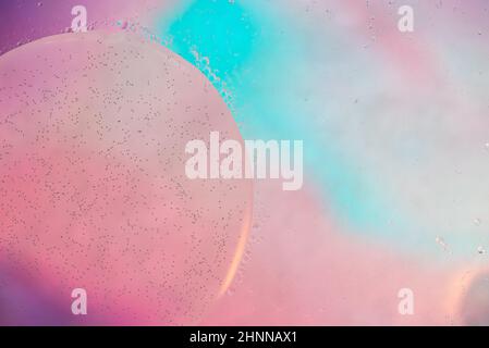 Oil drops in water. Defocused abstract psychedelic pattern image pastel colored. Abstract background with colorful gradient colors. Stock Photo