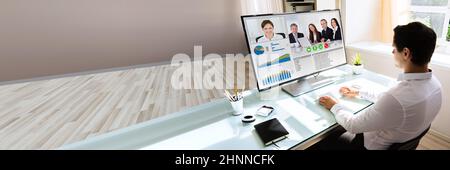 Virtual Conference Meeting In Office Room On Hybrid Convertible Laptop Stock Photo
