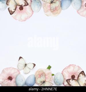 Pastel color background frame with pink spring flowers and Easter eggs . Happy Easter card Stock Photo