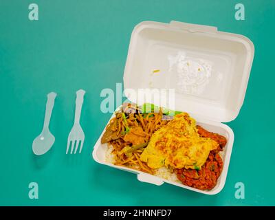 Thai food, stir fried crispy pork basil in box. Stock Photo