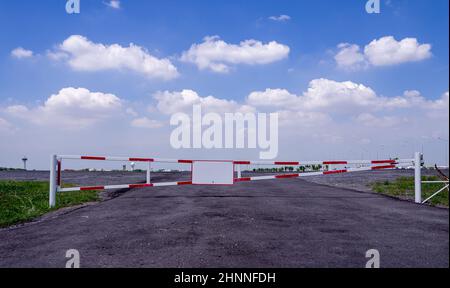 Close up of aged no parking sign at entrance gate at park. Stock Photo