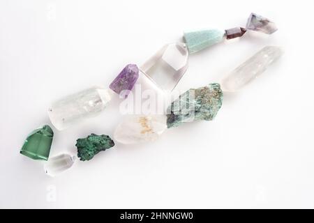 Set of healing minerals and crystal stones on white background. Flat lay of various gemstones and crystals Stock Photo