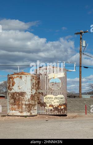 old historic silo with rotten painted advertising at the road in Seligman Stock Photo